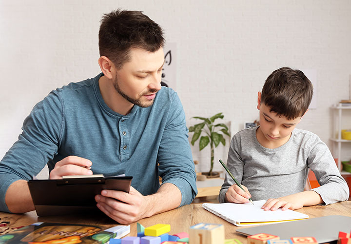 Male Psychologist providing psychoeducational assessment testing for child