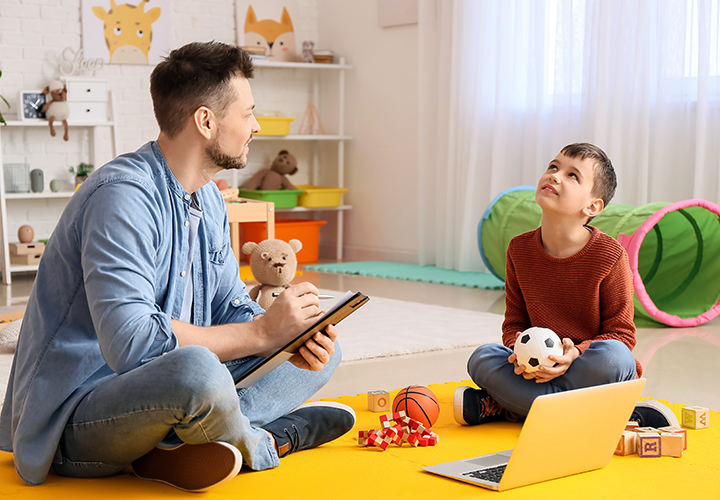 Psychologist testing teen boy for autism
