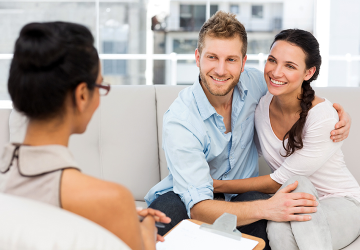 Couples therapist providing couples therapy to man and woman with relationship difficulty